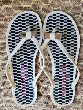 Coach Landon Cream And Black Jelly Sandals With Gold Bow